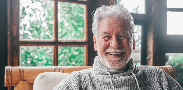 Closeup of senior man smiling at home