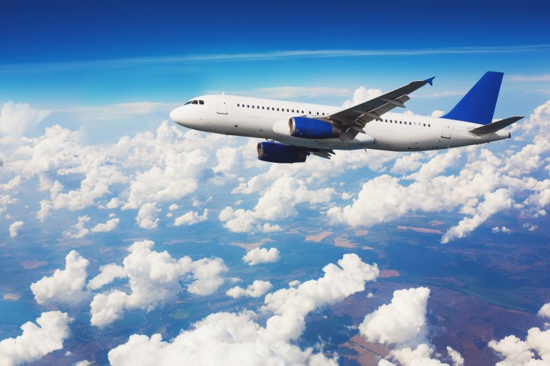 Airliner flies over clouds